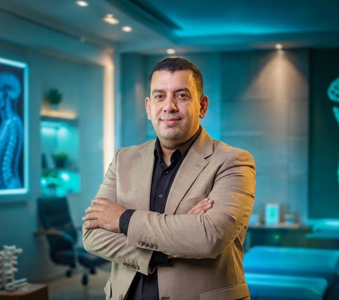 Dr. Osama Mowafy, board-certified neurosurgeon, in clinical attire